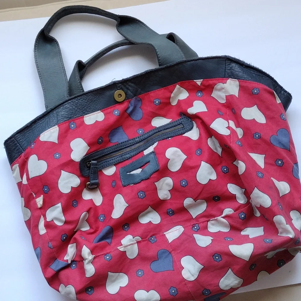 Anthropologie,Lucky Penny, leather purse with heart lining .